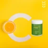 Lipocaps c 1000 od formeds na żóltym tle z literą c oraz przekrojoną pomarańczą