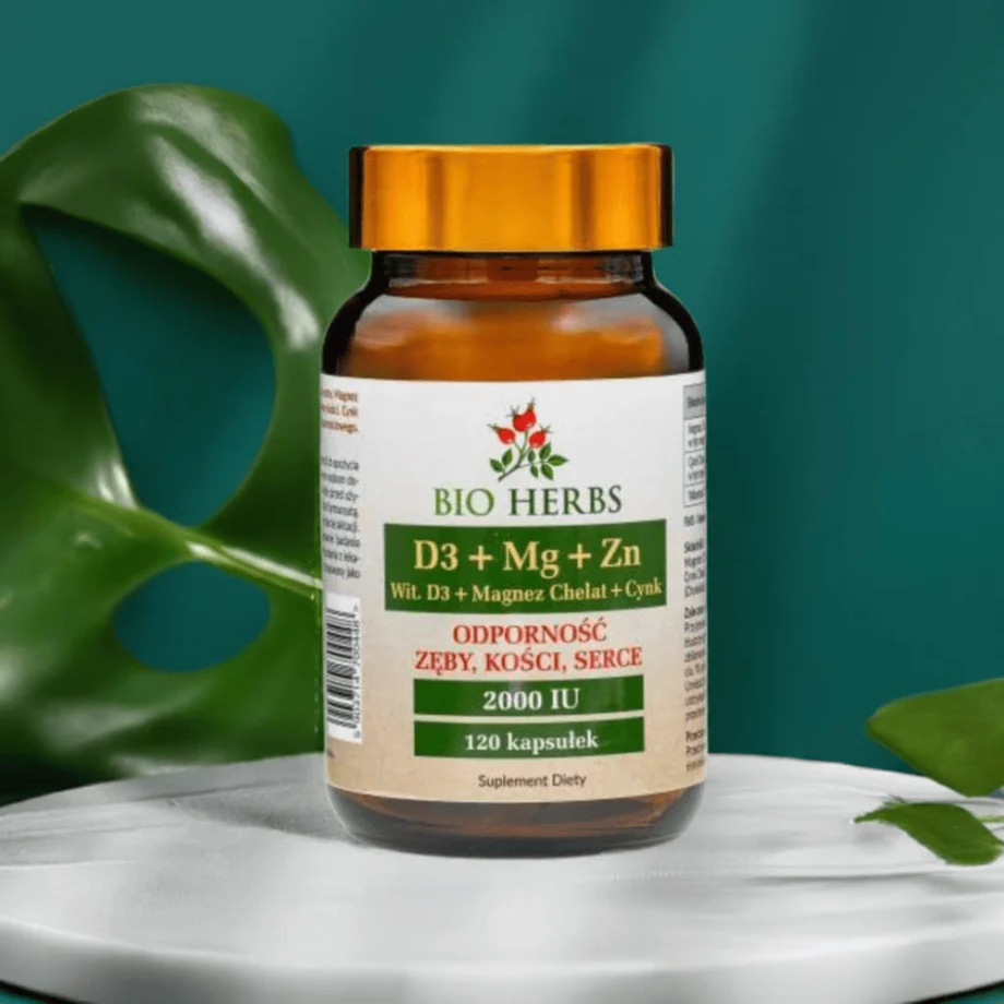 D3 Magnez Cynk Bio-Herbs - suplement premium na marmurowym blacie z zielonym liściem symbolizującym naturalny skład