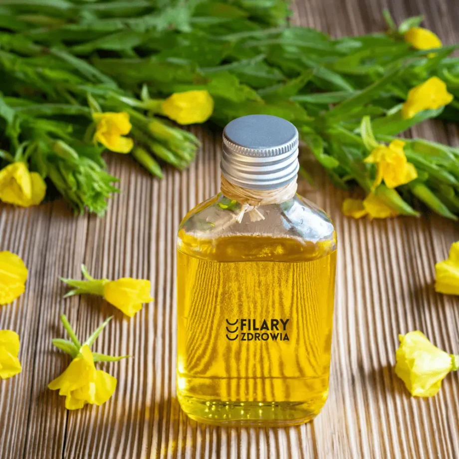Butelka organicznego oleju z wiesiołka z kwiatami wiesiołka - suplement diety z kwasami tłuszczowymi omega-6