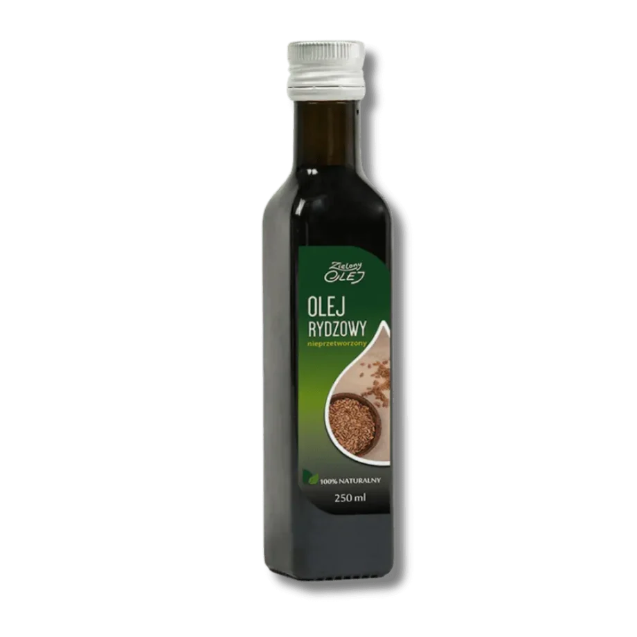 Butelka oleju rydzowego Zielony Olej, otoczona roślinami lnianki siewnej