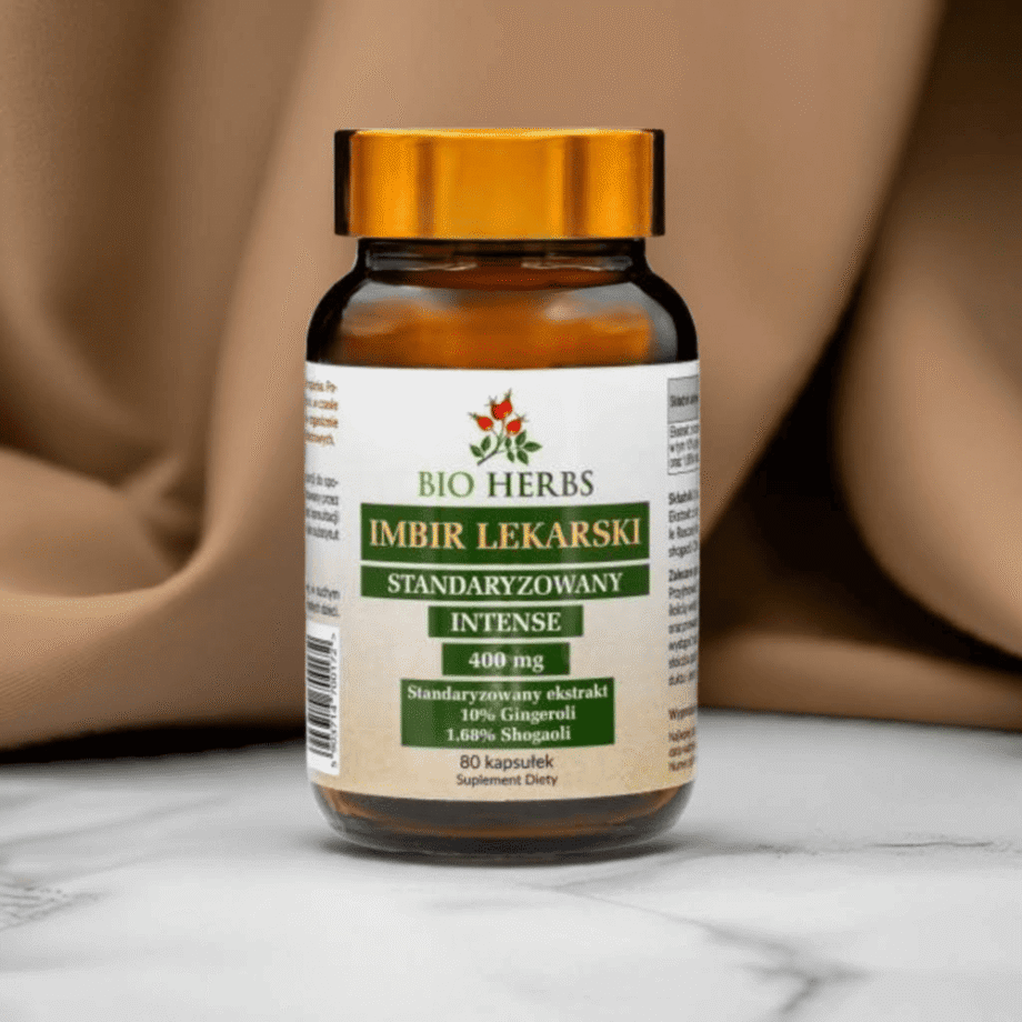 Opakowanie Imbiru Lekarskiego Bio-Herbs - 80 kapsułek wspierających odporność i trawienie na tle brązowej tkaniny